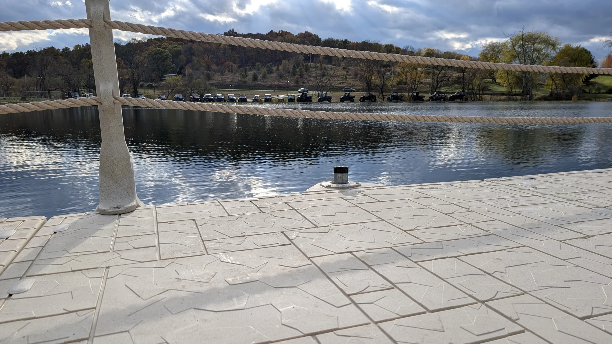 A close view of the Wave Armor deck surface, post cover and perimeter rope beside the water.