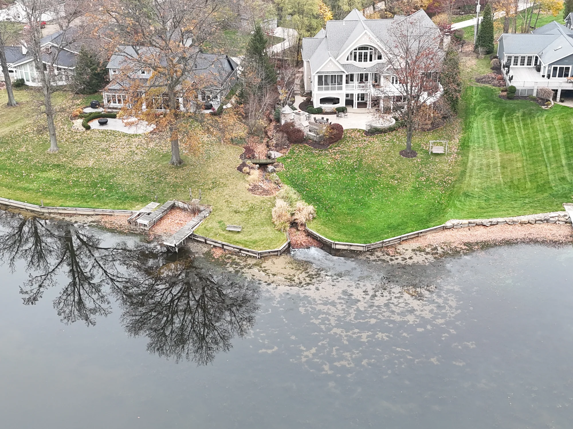 Congress Lake property before construction with the old dock and drainage outlet