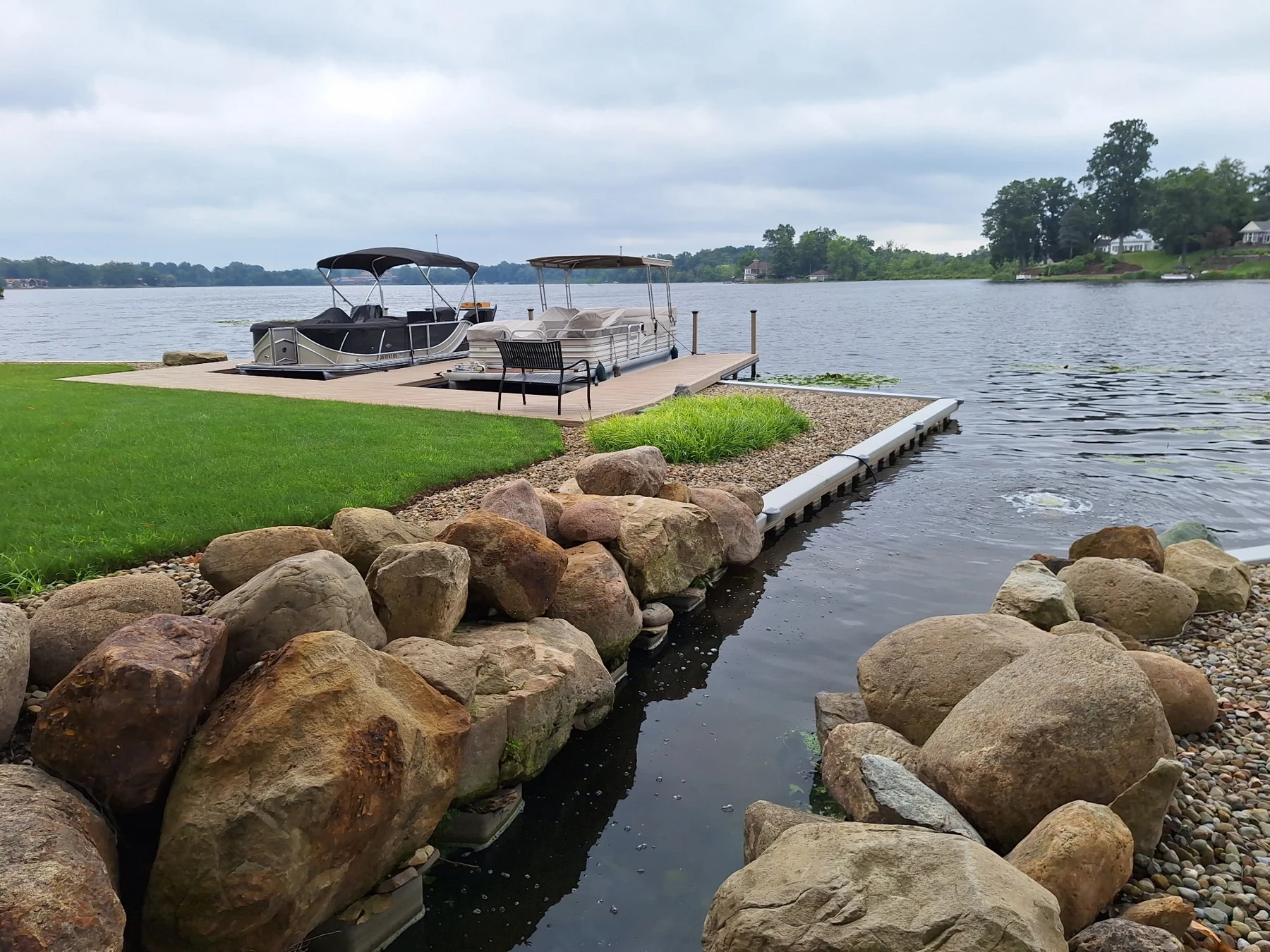 The boulder-lined drainage channel where it meets Congress Lake.