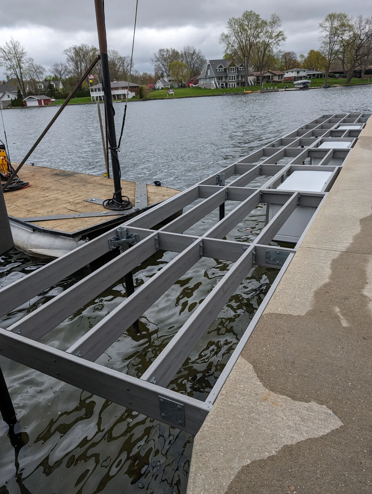 The dock framing running alongside the shoreline before decking was installed.
