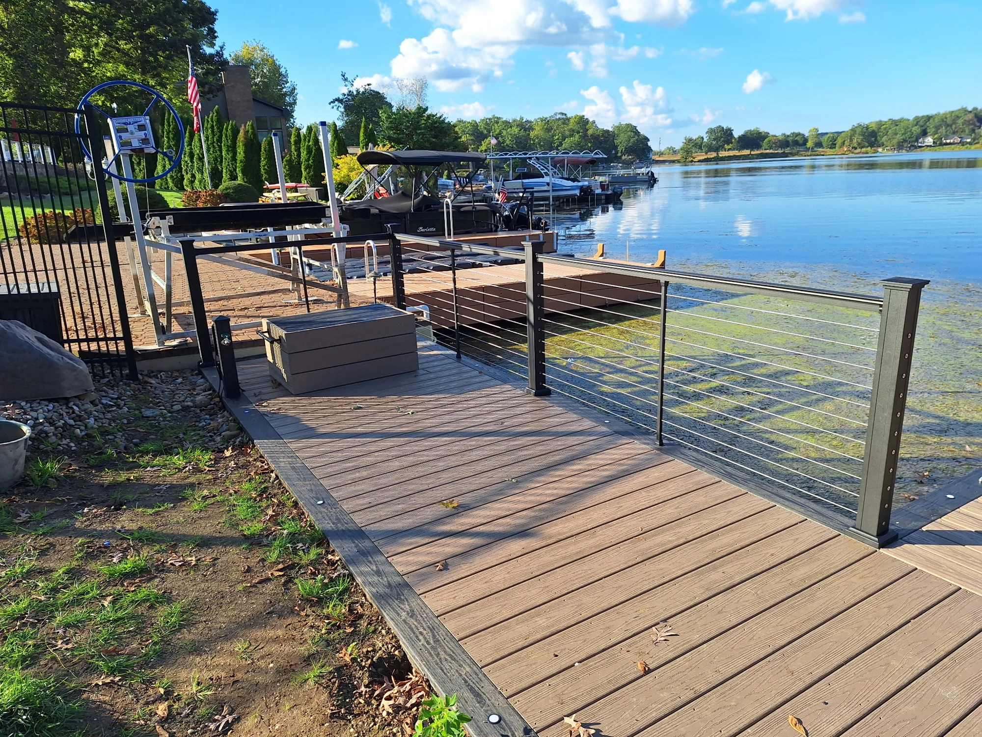 Dark KeyLink cable railing beside the picture-framed WearDeck boardwalk and dock.