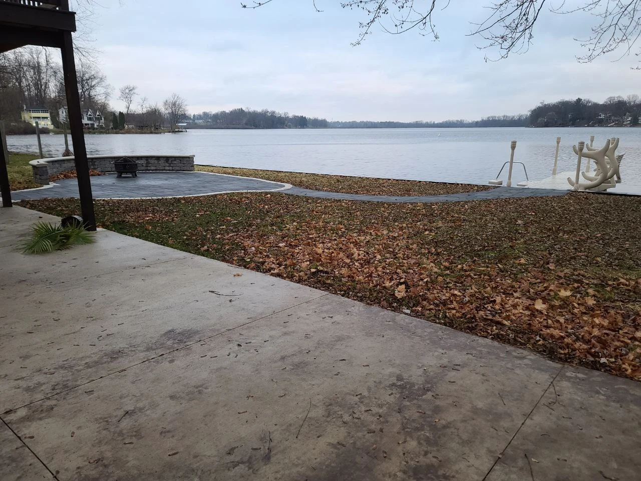 A view toward Long Lake and the dock, with the connecting walkway. Patio work by another company.