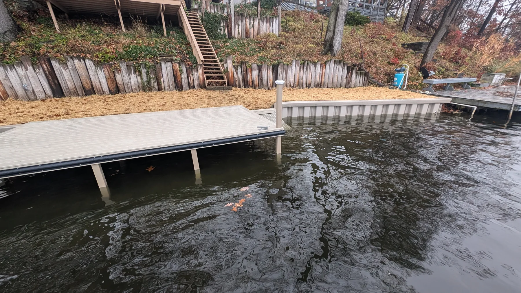 A view from the water showing the dock beside the new shoreline edge.