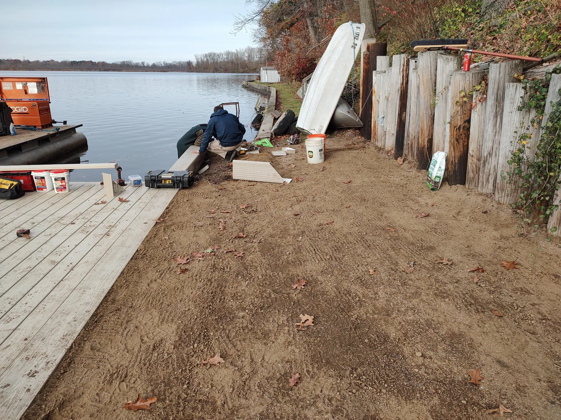 The crew fits the shoreline cap while the bank is being finished.