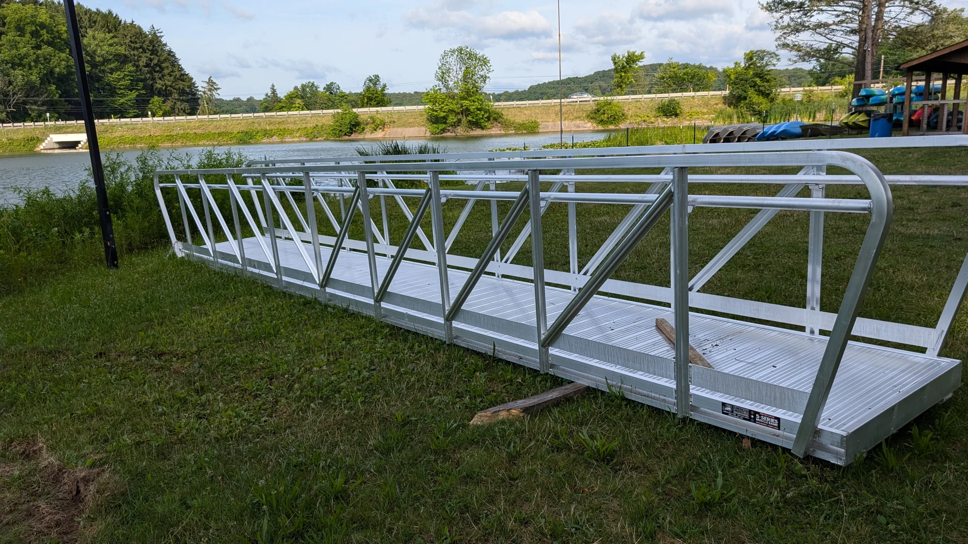 The metal gangway staged on the grass before installation.