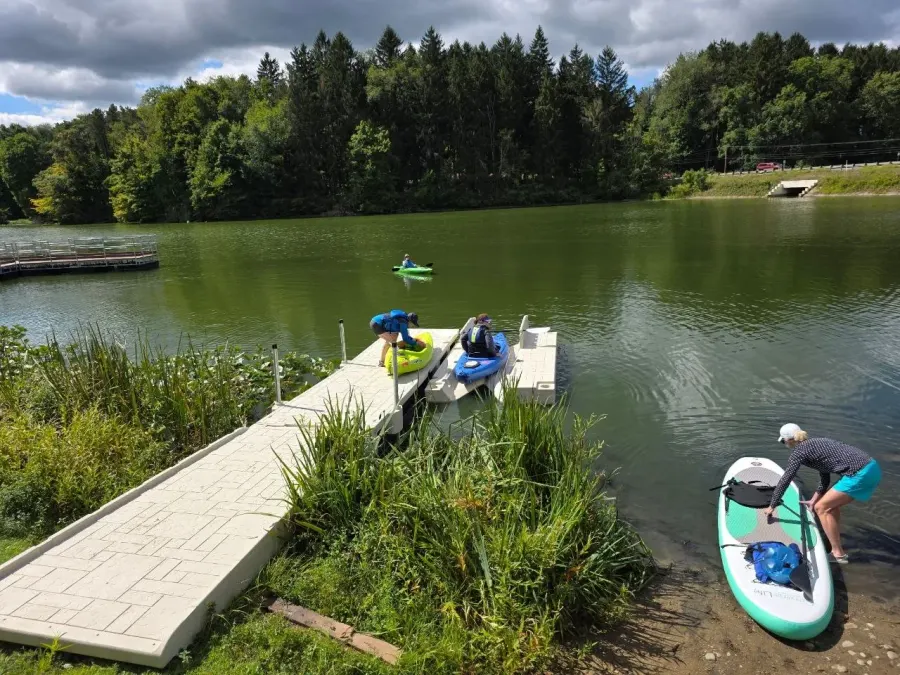 Paddlers using the Wave Armor kayak launch at Mogadore Reservoir