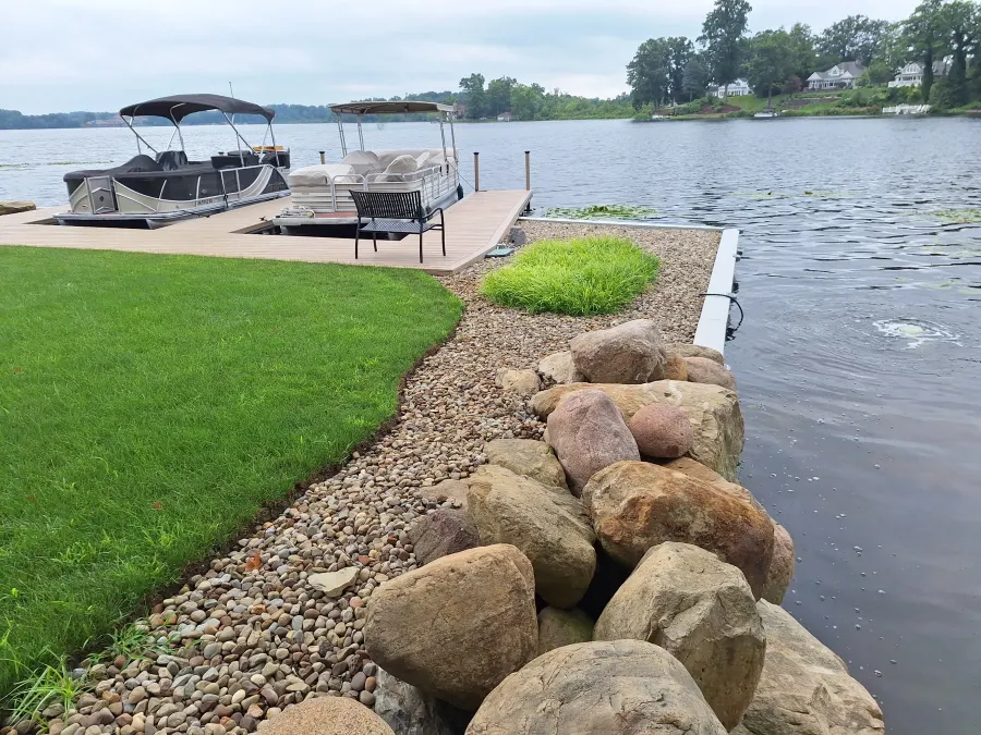 Completed Congress Lake shoreline with restored lawn and two pontoon berths