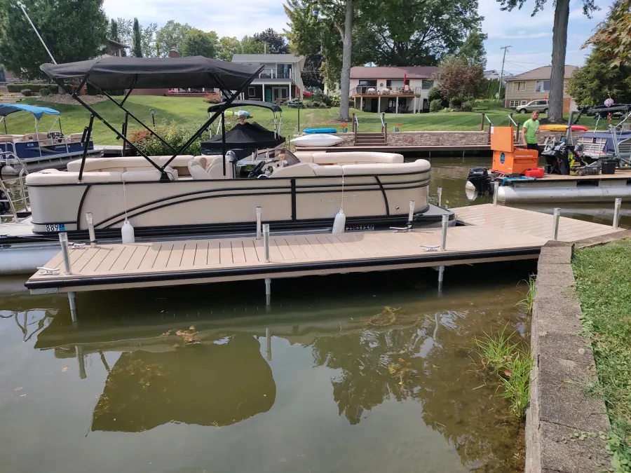 Beige custom WearDeck dock alongside a pontoon at Lake Cable