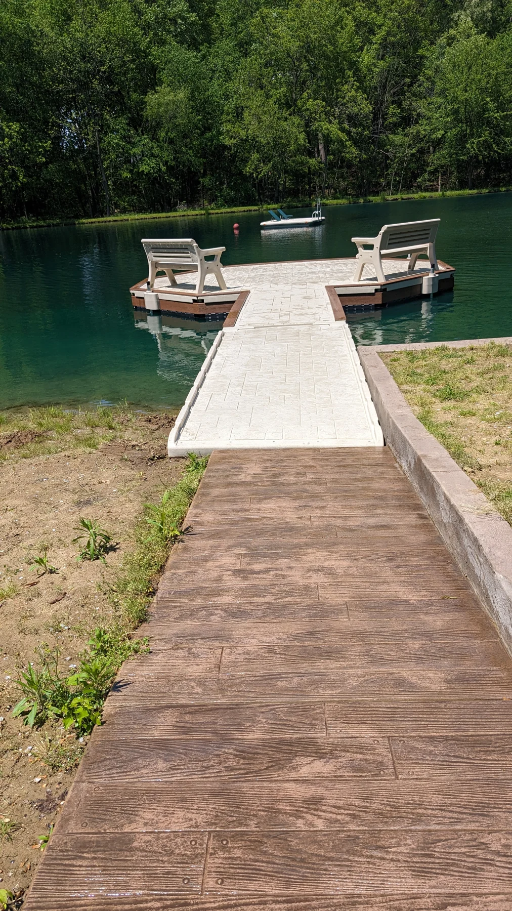 The shore approach leads onto the floating dock and its seating platform.