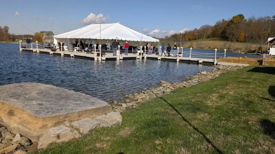 Guests gather on the platform during the winery and food grand opening.