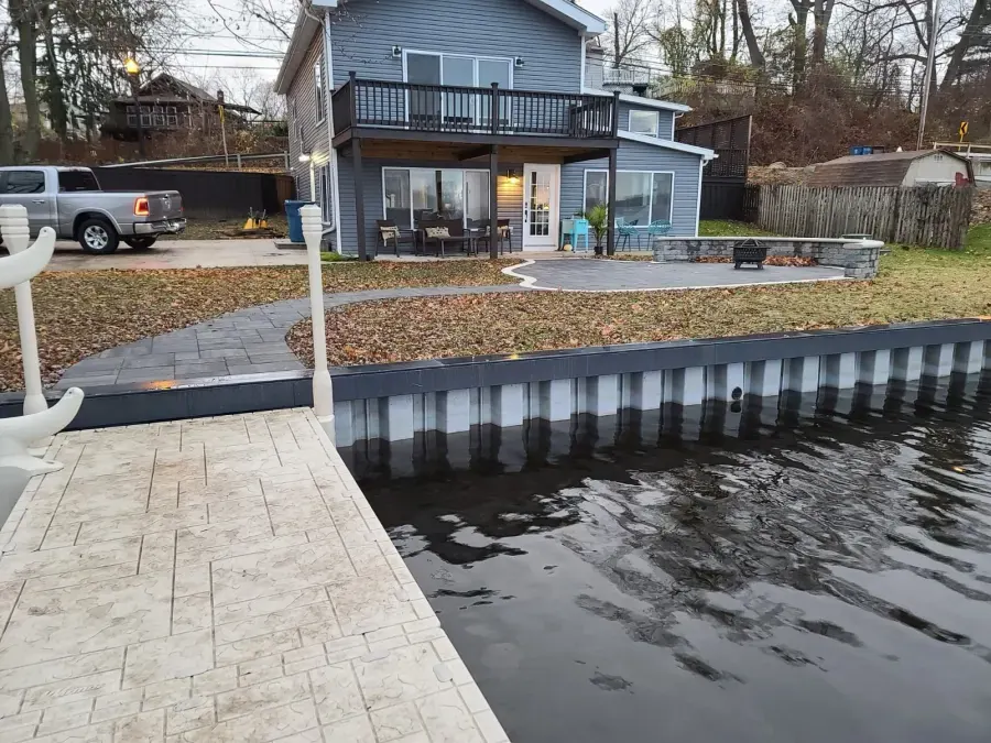 Landmark Lakehouse shoreline with seawall and connected dock