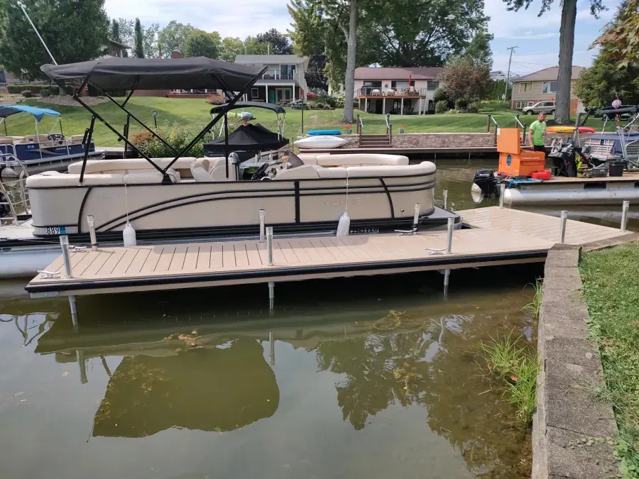 Beige custom WearDeck dock alongside a pontoon at Lake Cable